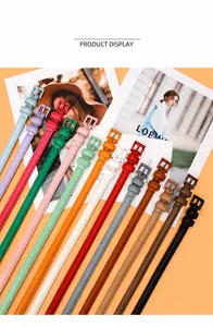 Selection of slim colorful women leather belts with metal buckles for dresses