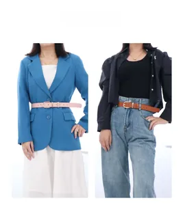 Styling of slim women's leather belts in pink and brown with golden horseshoe buckle