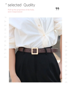 Detail view of a minimalist brown leather belt with a matte gold square pin buckle for women