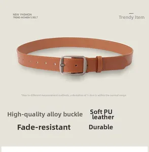 Detailed macro view of the brown PU leather belt with matte silver alloy buckle and stitching