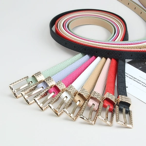 Minimalist candy-colored women's belts with golden textured buckles in a fan-shaped layout