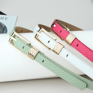 Three elegant candy-colored leather belts for women with textured finish and gold buckles