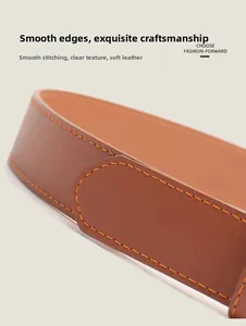 Close-up of brown leather belt showing soft texture and orange double stitching detail