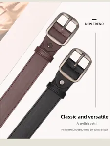 Detail of minimalist leather belts with matte metal pin buckles and reinforced stitching