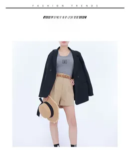 Chic women's fashion set featuring a brown leather belt with high-waist khaki shorts