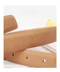 Detail of high-quality PU leather belt in brown finish with neat edge oiling and holes