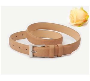 Detail of slim light brown leather belt with textured finish and silver pin buckle