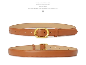 Detail of a brown leather belt with a golden oval metal buckle and fine stitching