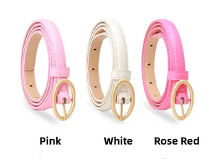 Detailed view of pink, white, and rose red thin belts with golden oval buckles