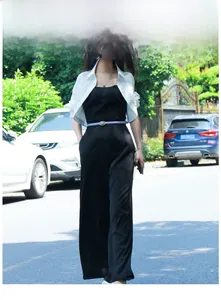 Chic women's thin purple waist belt paired with a sleek black sleeveless jumpsuit outfit