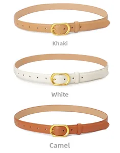 Close-up of minimalist women's leather belts in khaki, white and camel with gold buckles