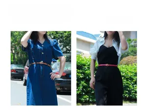 Close-up of thin brown and rose red leather belts with golden oval buckles on dresses