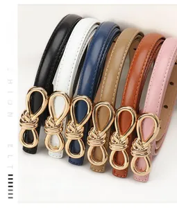 Close-up of colorful women's skinny belts featuring unique gold metal bow-knot buckles