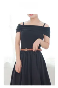 Minimalist brown leather belt with gold buckle styled on a black off-shoulder dress