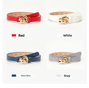 Detail view of slim belts in red, white, navy and gray with gold knot buckles