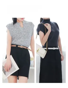 Asian model wearing slim brown and white faux leather belts with silver square buckles