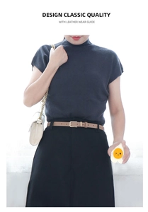 Classic khaki leather belt with gold square buckle styled on a black skirt