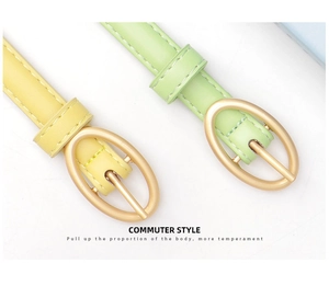 Detail of slim pastel belts with matte gold oval buckles and neat stitching finish