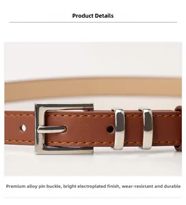 Detail of a brown leather belt featuring yellow stitching and a silver square alloy buckle
