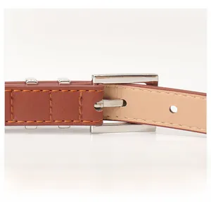 Detail view of premium dark brown faux leather belt with silver square buckle and rivets