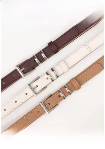 Three slim faux leather belts in coffee, cream and khaki with silver square buckles