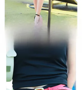 Fashionable pink waist belt with metal pin buckle styled with sandals and a green bag
