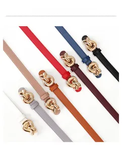 Detail shot of slim belts in eight colors featuring stylish golden metal knot buckles