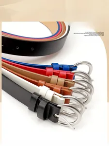 Detail showing various colors of thin leather belts with silver alloy pin buckles