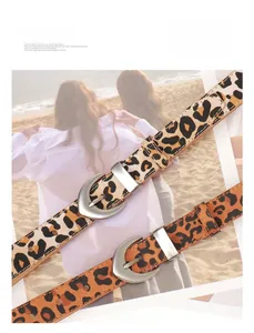 Detail of leopard print PU leather belts with silver buckle for fashionable dresses