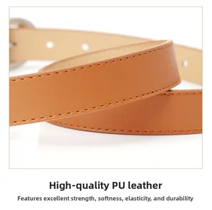 Close-up of premium brown PU leather belt showing fine lychee grain and stitching
