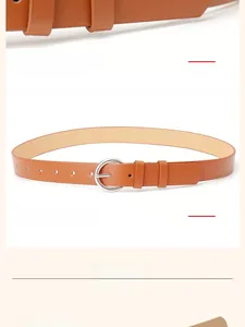 Detailed view of women's brown leather belt featuring a classic silver round pin buckle