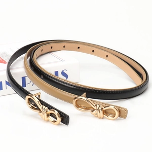 Women's slim leather belts in black and khaki with elegant gold bow buckles