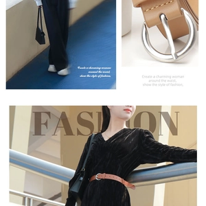 Detail shots of light brown leather belt with silver round buckle for dresses and jeans