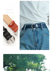 Detail of slim faux leather belts in black, brown, and navy with silver metal buckles