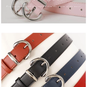Detail of colorful PU leather belts for women with silver metal buckles and round holes