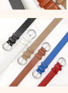 Detail showing various colors of women's slim belts with silver round buckles for jeans