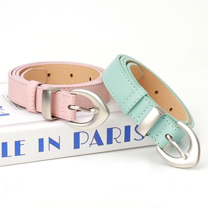 Detailed macro of slim macaron-colored PU leather belts with silver matte metal buckle
