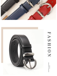 Detail of slim women's faux leather belts with polished silver oval metal buckles