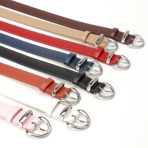Women's minimalist faux leather belts with round silver buckles in eight stylish colors