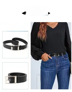 Close-up of classic black PU leather belt with a polished silver square metal buckle