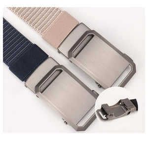 Detail of nylon web belts with brushed metal automatic buckle and internal mechanism