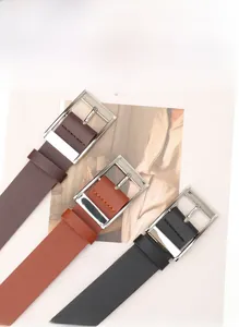 Detailed close-up of PU leather belts in black, brown, and tan with silver square buckles