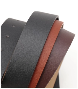 Close-up detail of multi-color PU leather belts showing grain texture and edge finish