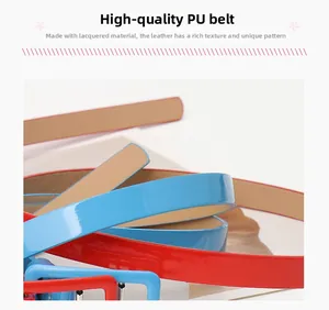 Close-up of glossy red and blue PU leather belts with high-shine finish and durable texture