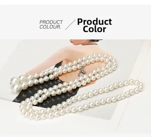 Detail view of multi-layer pearl waist chain with metal lobster clasp closure