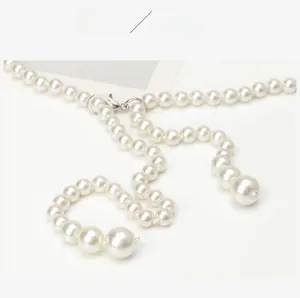 Detail of elegant multilayer pearl waist chain with lobster clasp for dresses