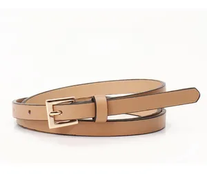 Detail view of the khaki PU leather waist belt with polished gold square metal buckle