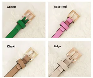 Close-up of thin leather belts with gold square buckles in green, rose, khaki and beige