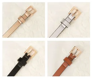 Detail view of thin PU leather belts in gold, silver, black and camel with square buckles