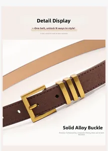 Détail de la boucle en alliage doré et ceinture en daim marron foncé avec placage composite